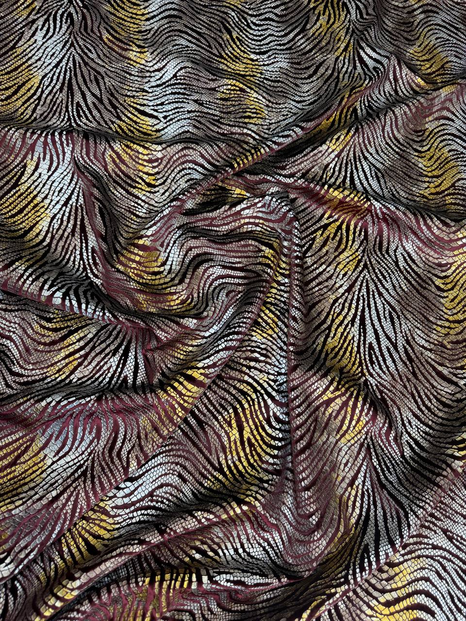 Multicolour Wave fabric: undulating waves in multicolour: rose, gold and dark tones. Original fabric photograph.