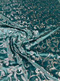 Teal Scroll fabric: scrolling vines in teal and silver tones. Original fabric photograph.