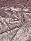 Rose Scroll fabric: scrolling motifs in dusty rose and metallic tones. Original fabric photograph.
