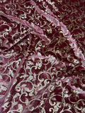 Burgundy Scroll fabric: scrolling vines in burgundy and pale metallic tones. Original fabric photograph.