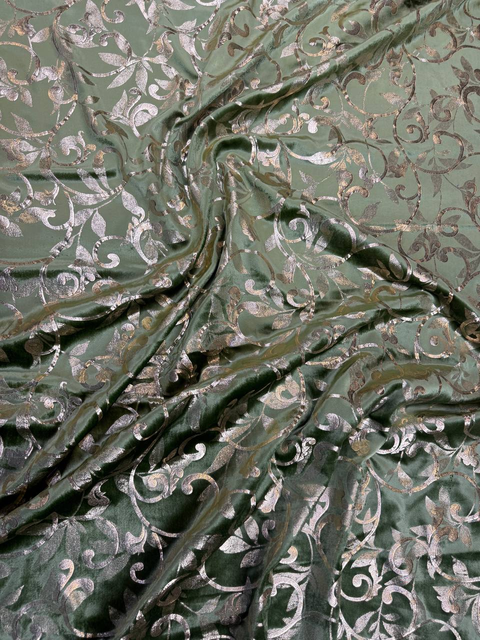 Sage Scroll fabric: scrolling botanical vines in sage and pale metallic tones. Original fabric photograph.