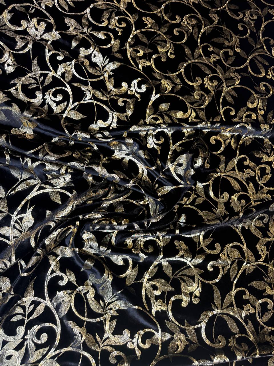 Black & Gold Scroll fabric: ornamental scrollwork in black and gold tones. Original fabric photograph.