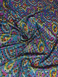 Multicolour Paisley fabric: paisley in multicolour: teal, pink, blue and yellow. Original fabric photograph.
