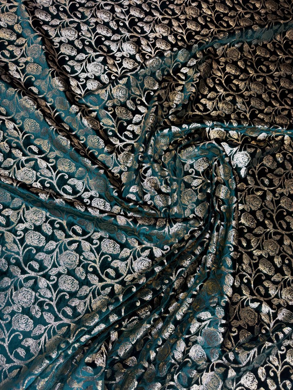 Teal Leaf fabric: dense botanical repeat in teal and pale metallic tones. Original fabric photograph.