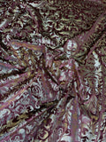 Burgundy Damask fabric: damask-inspired ornament in burgundy and pale metallic tones. Original fabric photograph.