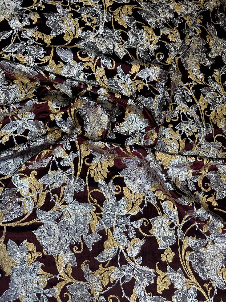 Burgundy Botanical fabric: large botanical motifs in burgundy, silver and gold tones. Original fabric photograph.