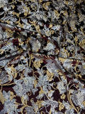 Burgundy Botanical fabric: large botanical motifs in burgundy, silver and gold tones. Original fabric photograph.