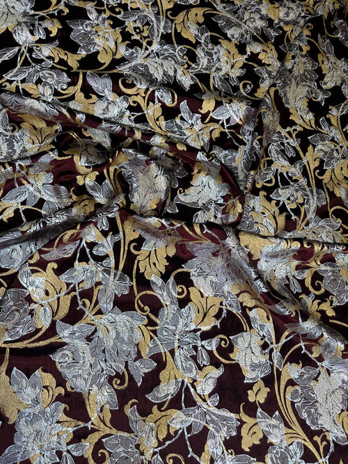 Burgundy Botanical fabric: large botanical motifs in burgundy, silver and gold tones. Original fabric photograph.