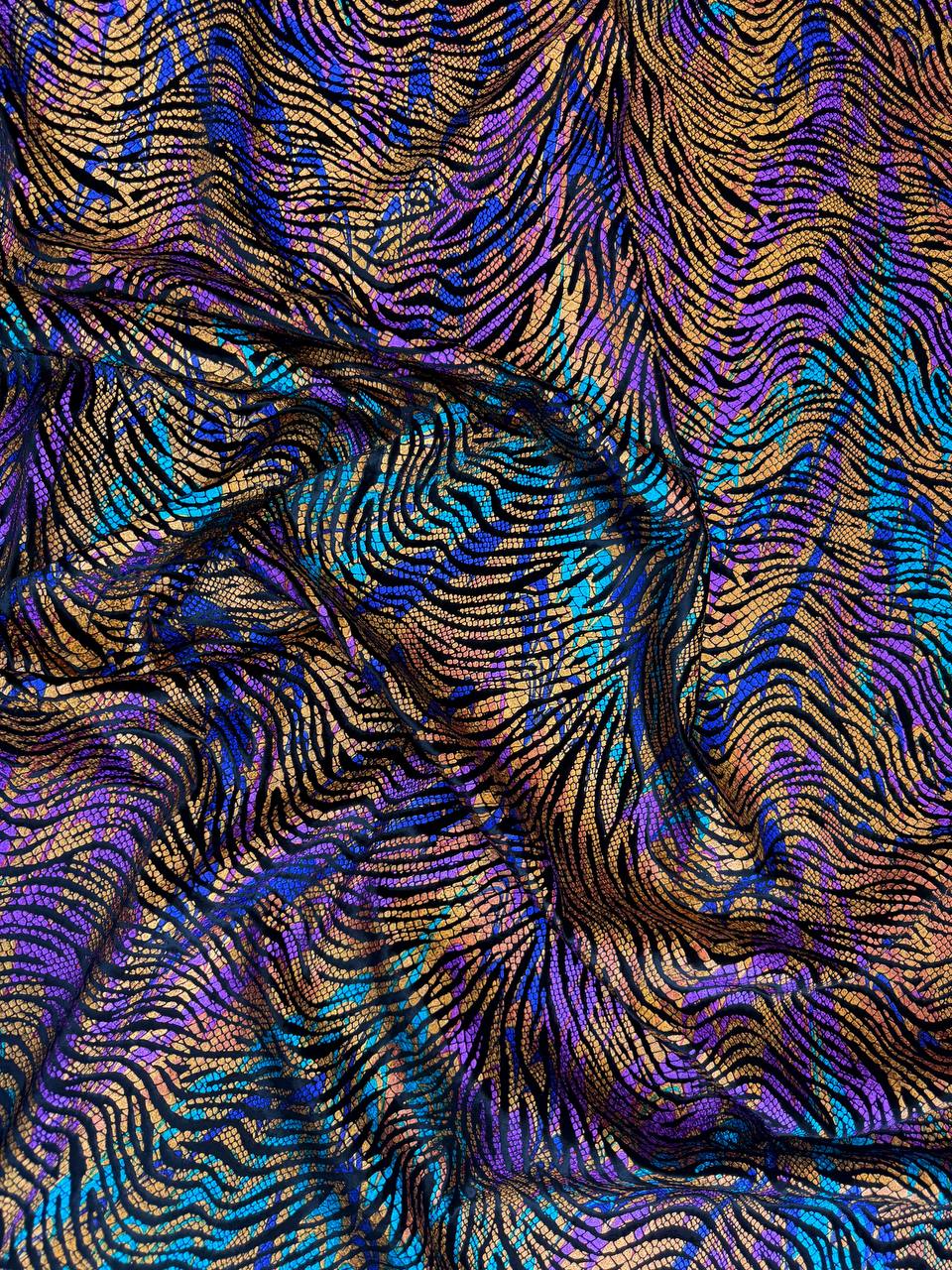 Jewel Wave fabric: multicolour waves in violet, teal and gold tones. Original fabric photograph.