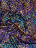 Jewel Wave fabric: multicolour waves in violet, teal and gold tones. Original fabric photograph.
