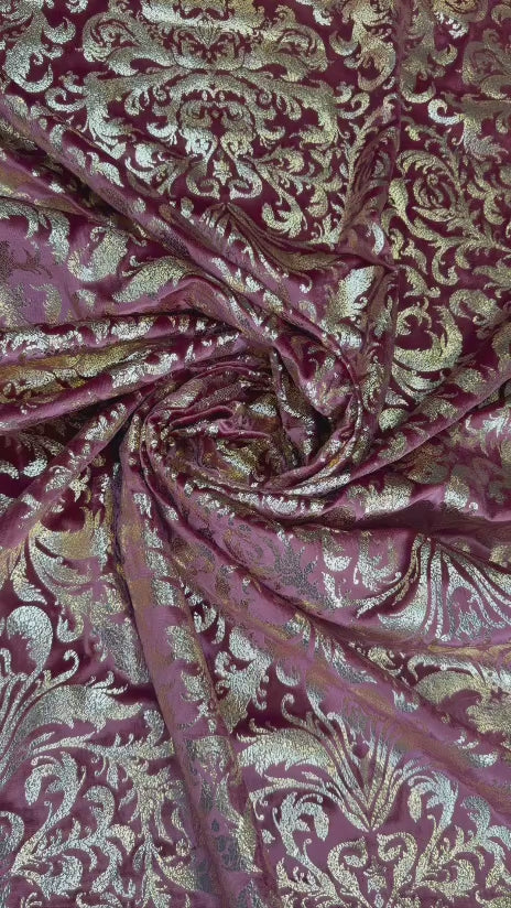 Original video showing burgundy damask fabric in movement, with damask-inspired ornament.