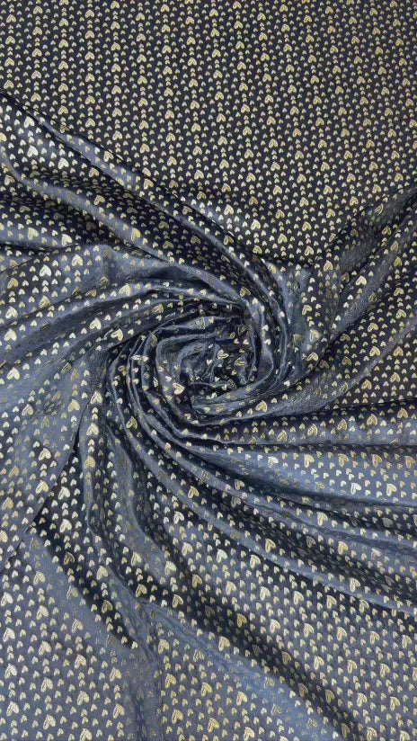 Original video showing midnight gold micro motif fabric in movement, with small repeating motifs.