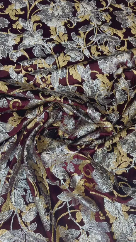 Original video showing burgundy botanical fabric in movement, with large botanical motifs.