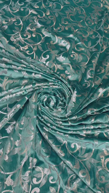 Original video showing teal scroll fabric in movement, with scrolling vines.