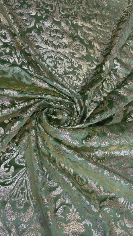 Original video showing sage damask fabric in movement, with damask-inspired ornament.