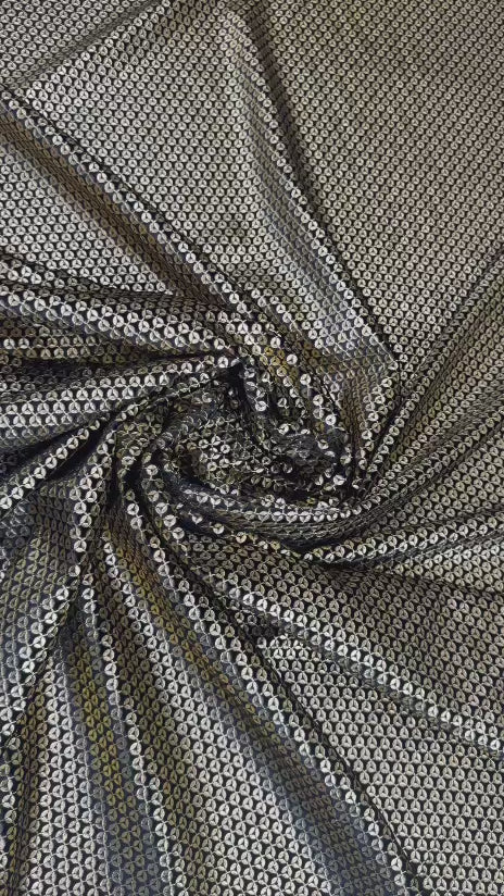 Original video showing metallic micro pattern fabric in movement, with small geometric repeat.