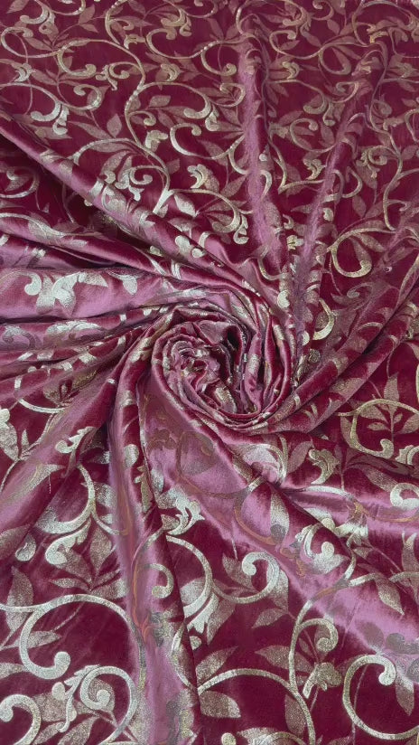 Original video showing burgundy scroll fabric in movement, with scrolling vines.